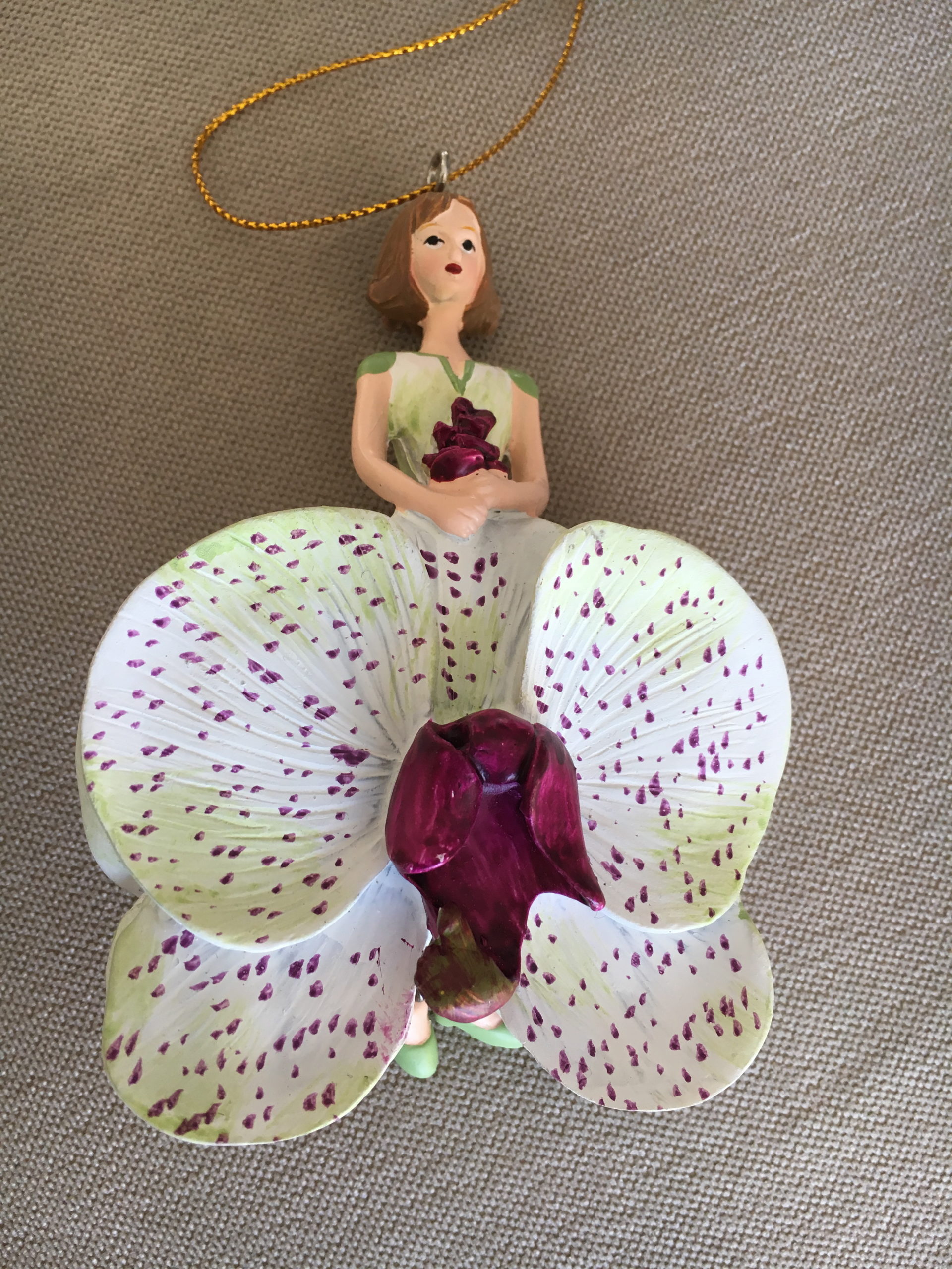 Adorable figurine wooden orchid