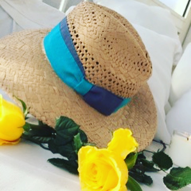 Beautiful hat made with natural straw and turquoise ribbon one size